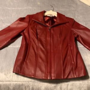 Size  small new. Leather coat.  Maroon